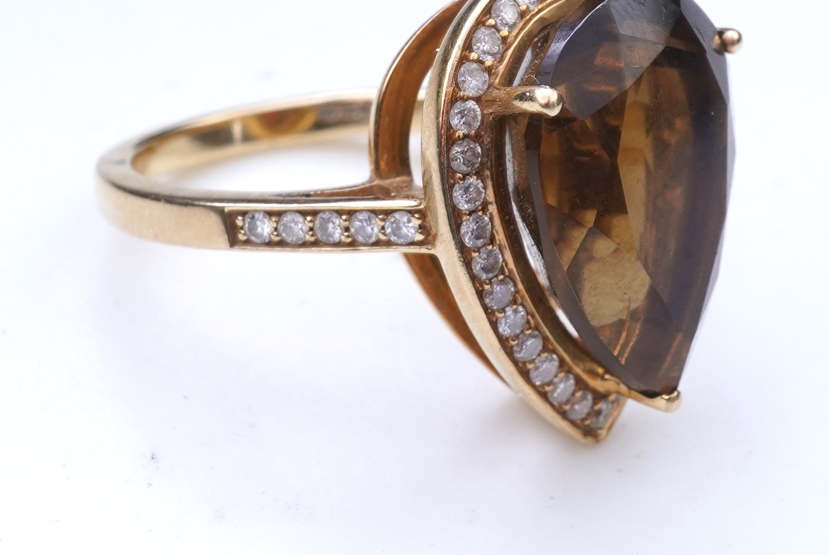 A smoky quartz and diamond ring